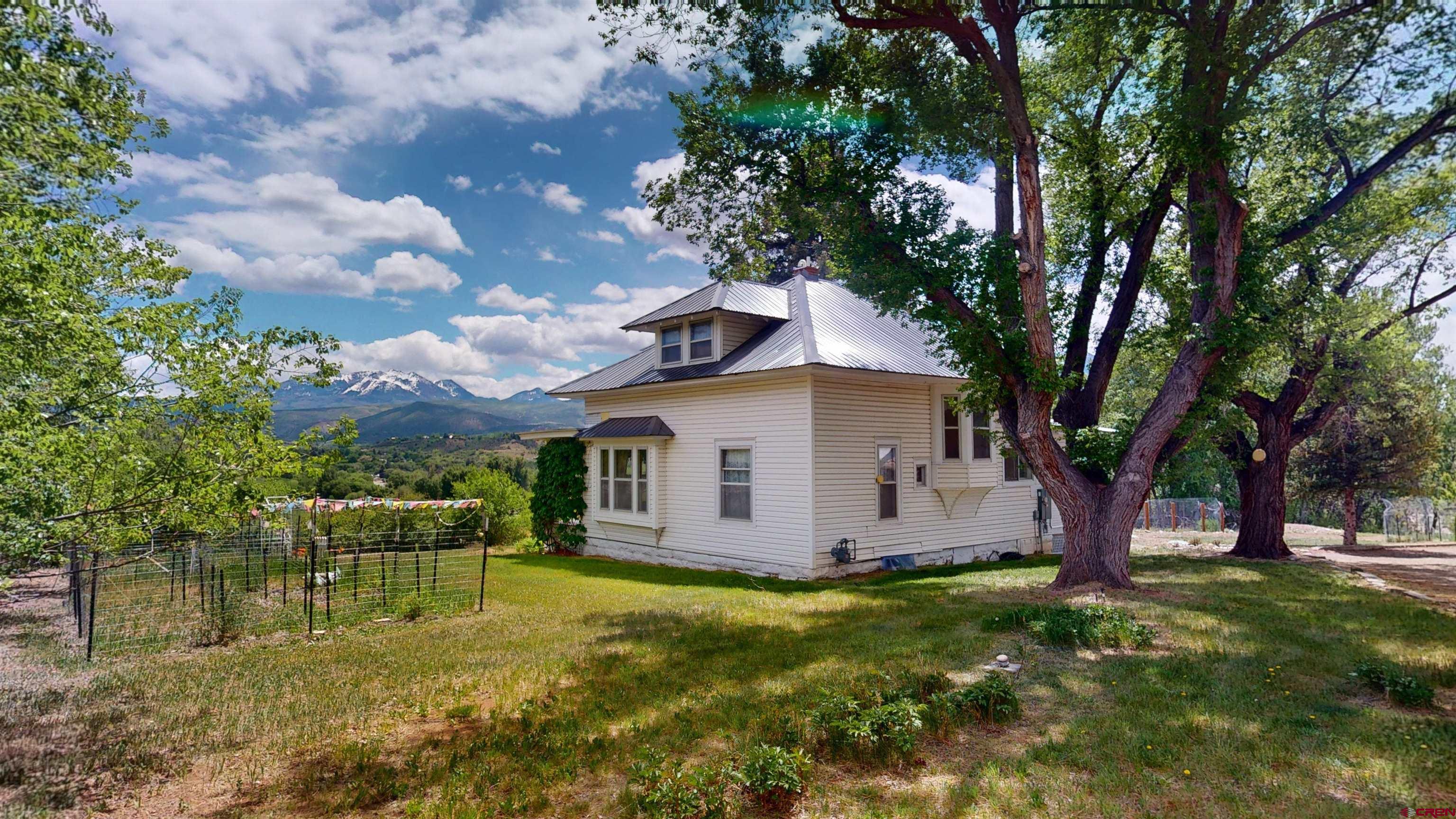39778 Pitkin Road Paonia, CO 81428 - Photo 31 of 45 a view of a house with a yard