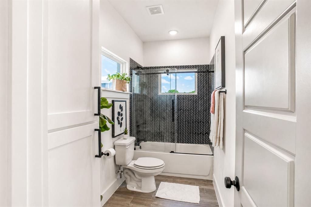 311 Dobbs Trail Springtown, TX 76082 - Photo 32 of 33 a bathroom with a toilet a sink and shower