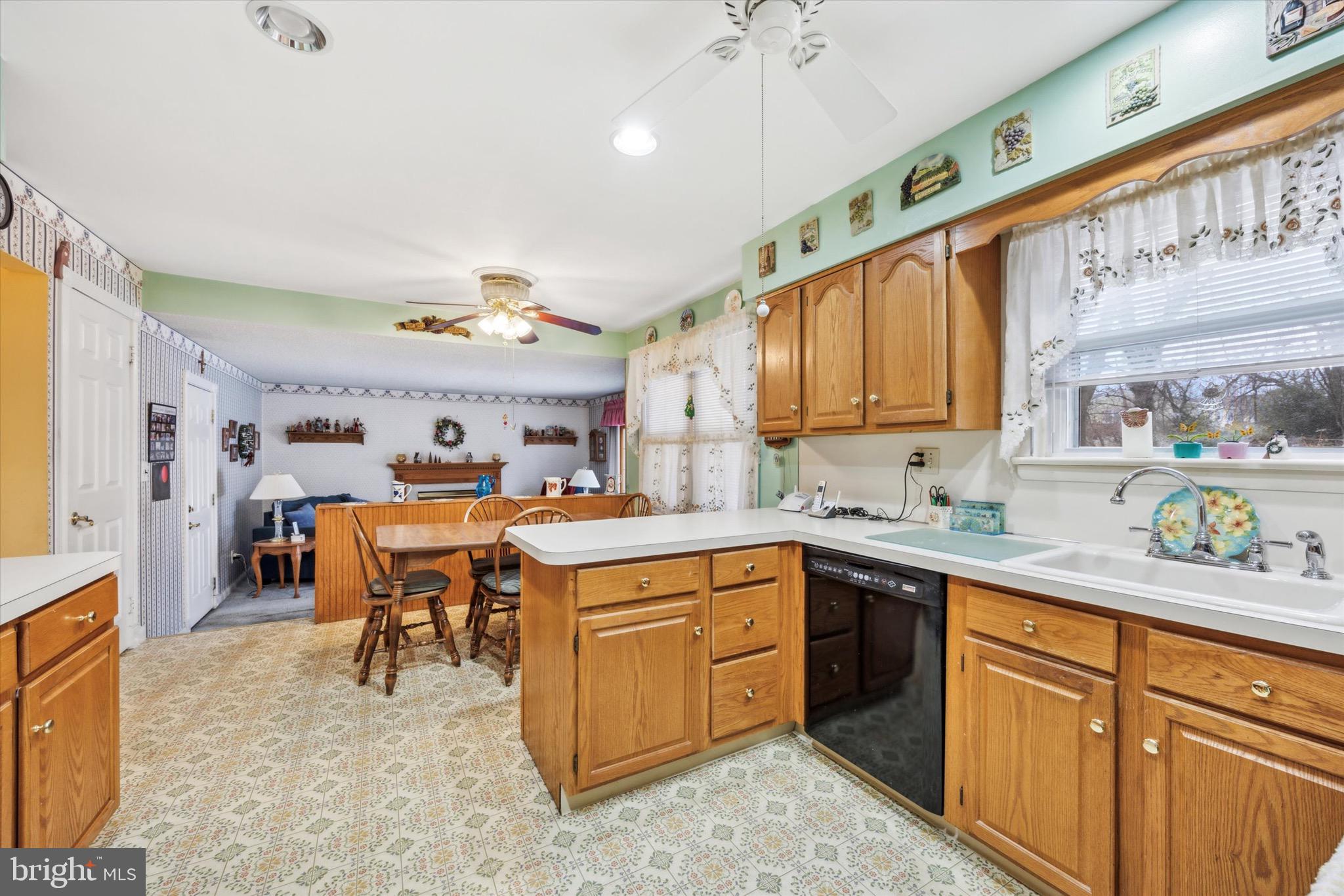 215 Bridge Road Upper Chichester, PA 19061 - Photo 5 of 15 a kitchen with a sink stove and cabinets