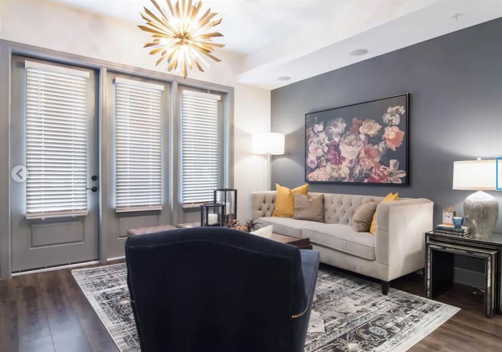 6500 Aria Boulevard, Unit 155 Sandy Springs, GA 30328 - Photo 4 of 7 a living room with furniture and a large window