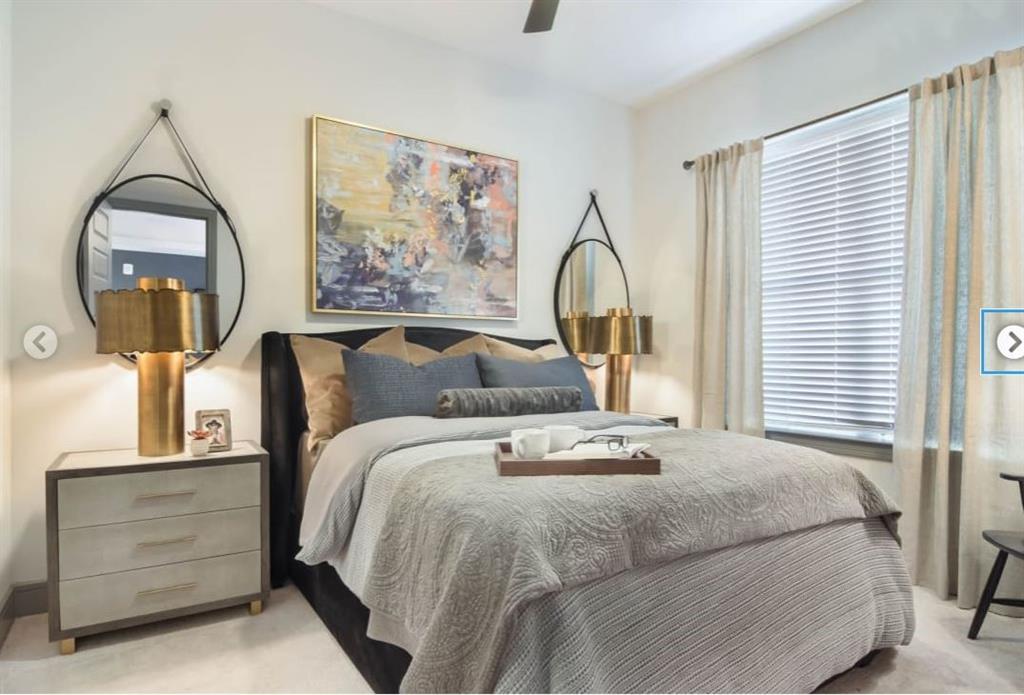 6500 Aria Boulevard, Unit 155 Sandy Springs, GA 30328 - Photo 5 of 7 a bedroom with bed and a painting on the wall