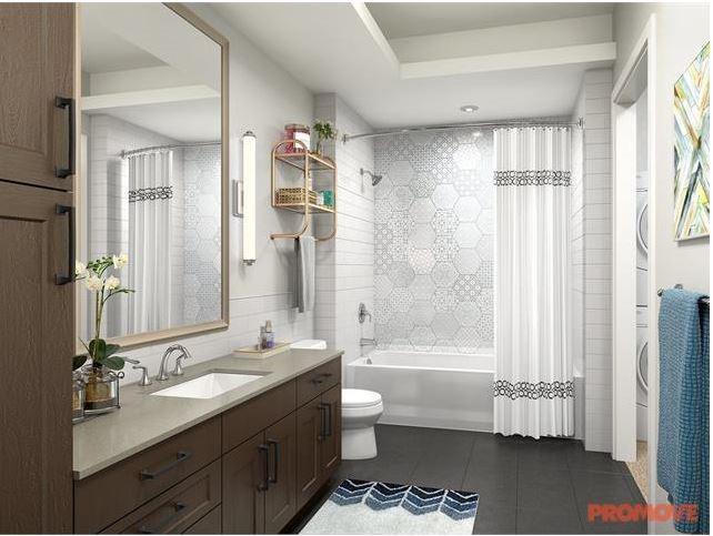 6500 Aria Boulevard, Unit 155 Sandy Springs, GA 30328 - Photo 6 of 7 a bathroom with a granite countertop sink toilet and shower