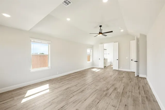 a view of an empty room with a window