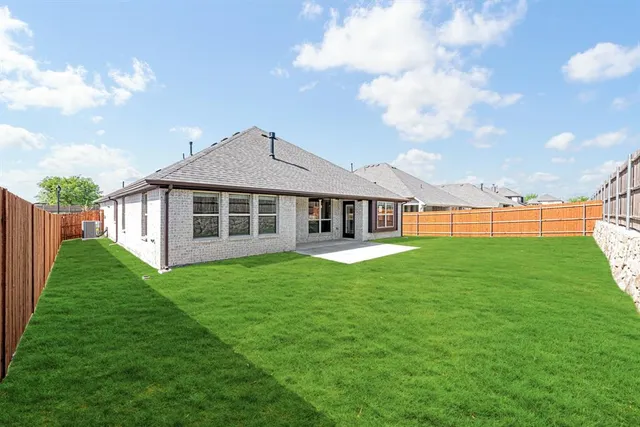 a view of a house with a big yard