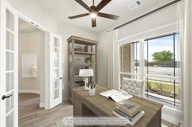 a living room with hard wood floors and a window