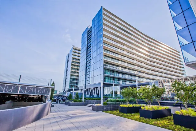 a view of a tall building from the roof deck