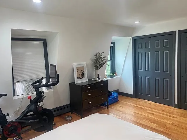 a view of a livingroom with furniture and a potted plant