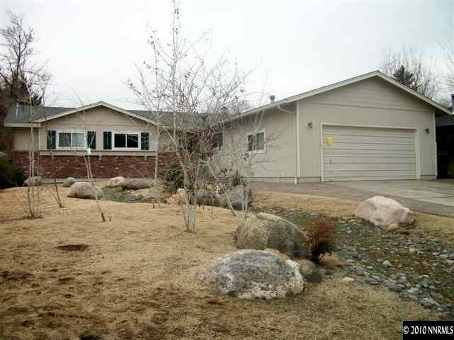280 Wildrose Drive Reno, NV 89509 - Photo 1 of 9 a front view of a house with a yard covered in snow