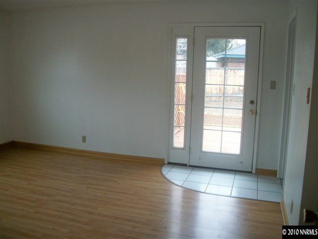 280 Wildrose Drive Reno, NV 89509 - Photo 6 of 9 an empty room with wooden floor and windows