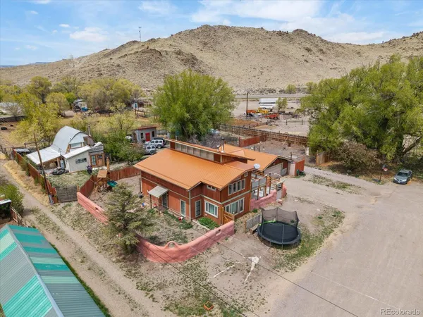 an aerial view of a house with a garden
