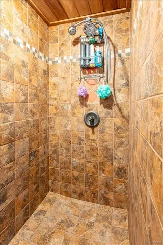 a bedroom with a bed and a mirror