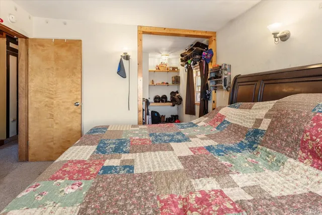 a living room with furniture toys and a large window