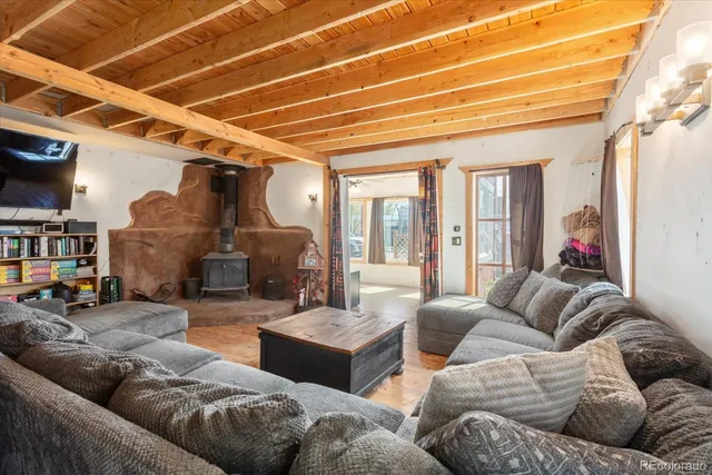 a living room with furniture ceiling fan and a rug