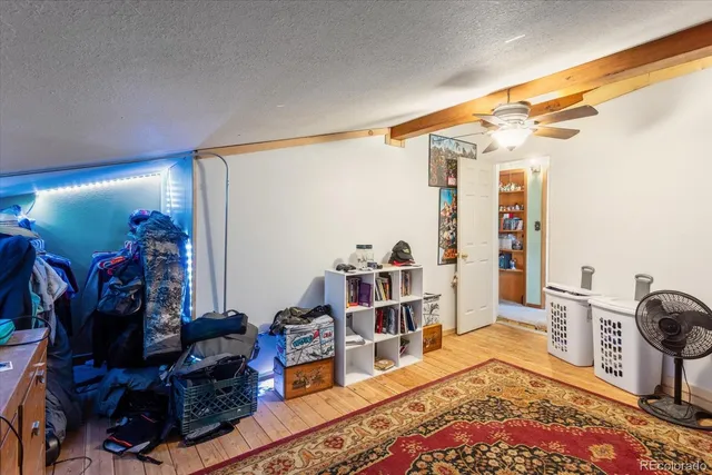 a bed room with a bed a bed and a desk