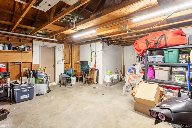 a front view of a house with barbeque grill and stairs