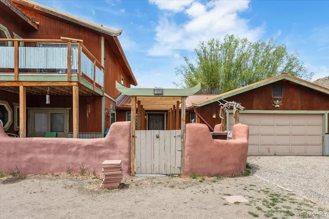 a view of roof with wooden floor and city view