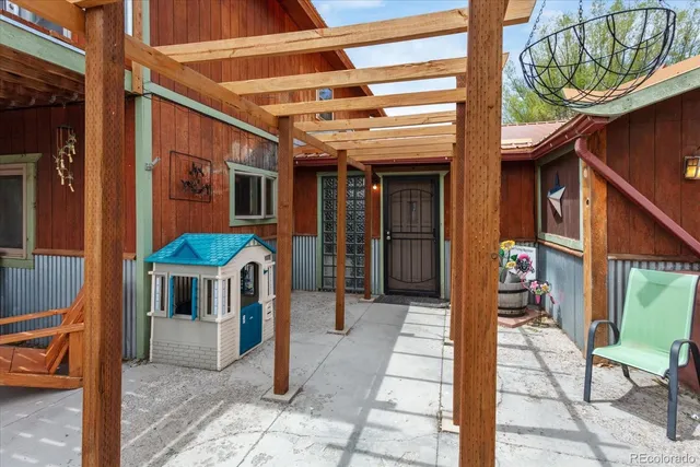 a view of house with a patio