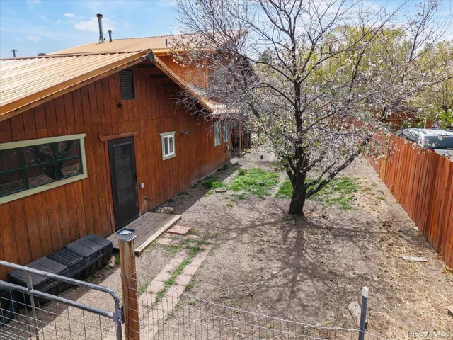 an aerial view of a house with a garden