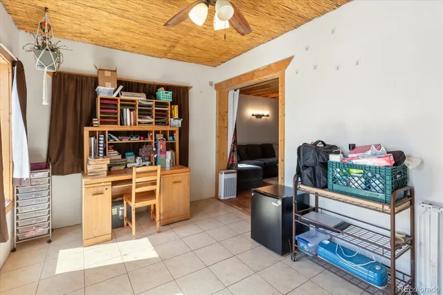 a view of a dining area with furniture and a large window