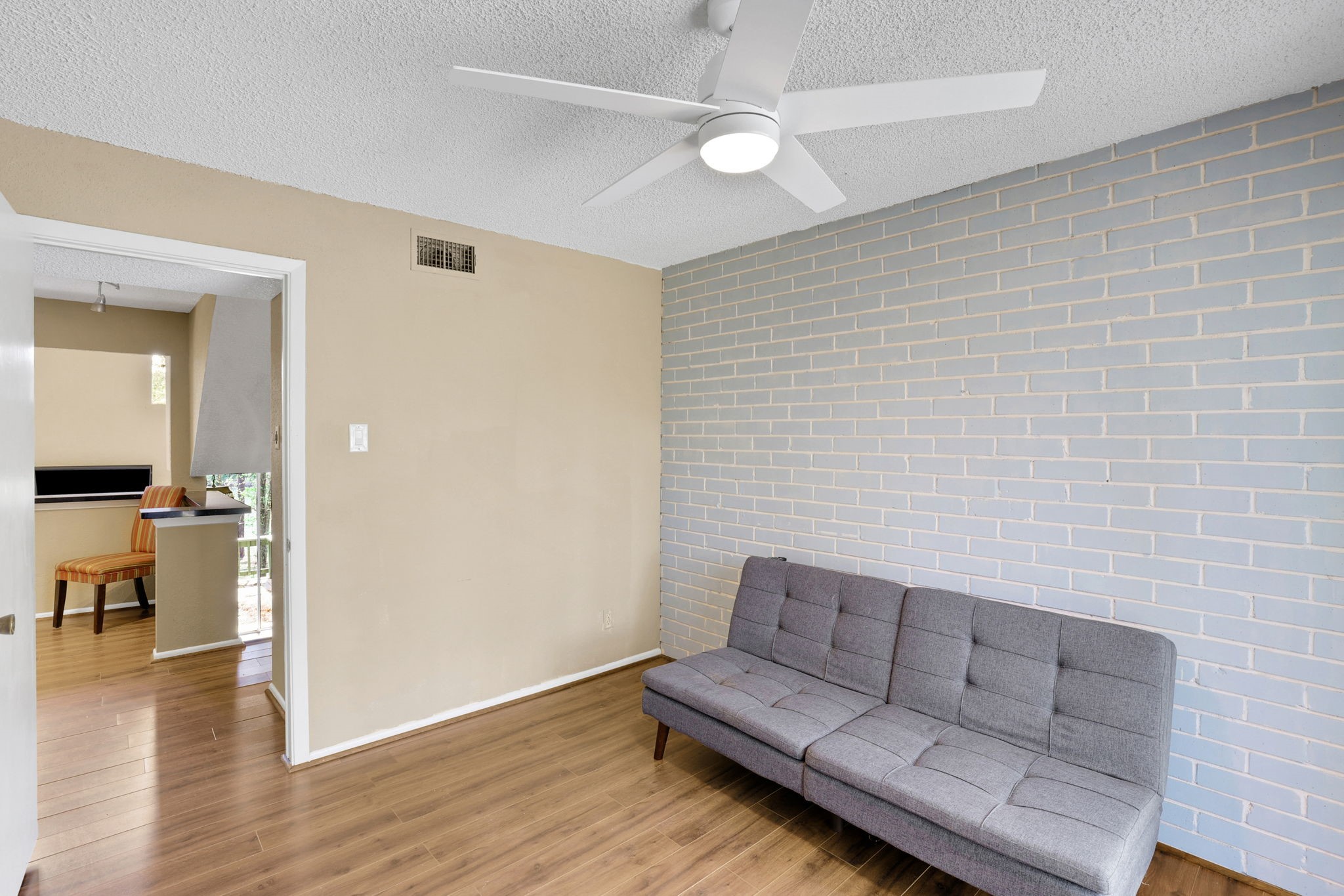 178 Villa Way Coldspring, TX 77331 - Photo 20 of 43 a living room with furniture and a wooden floor