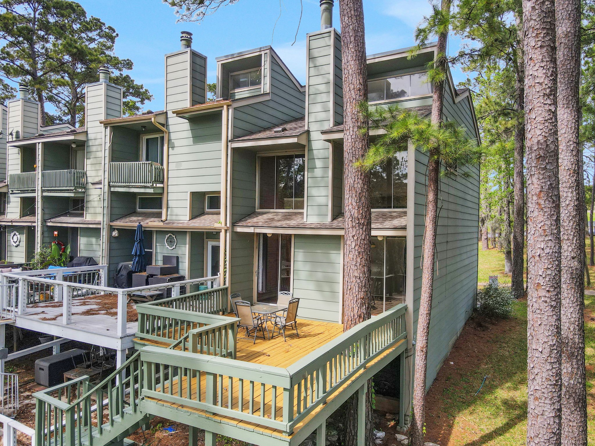 178 Villa Way Coldspring, TX 77331 - Photo 31 of 43 a balcony with table and chairs