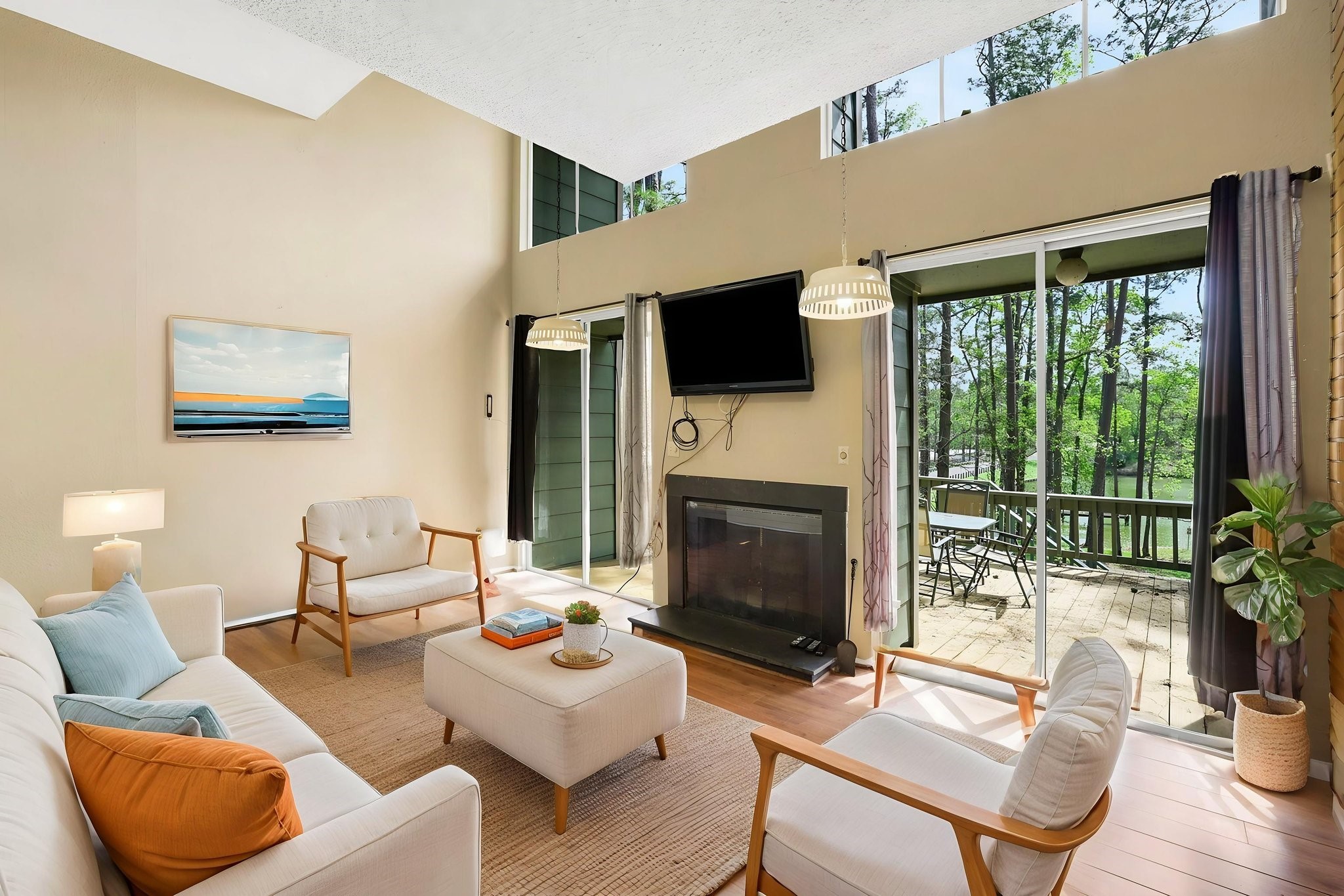 178 Villa Way Coldspring, TX 77331 - Photo 5 of 43 a living room with furniture a fireplace and a flat screen tv