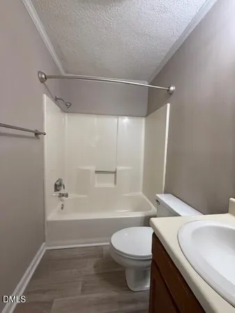 a bathroom with a toilet a sink and a bathtub