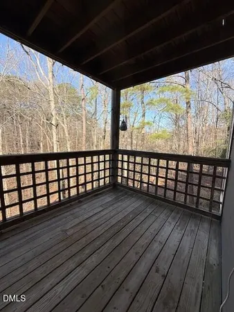 a view of wooden balcony with wooden floor