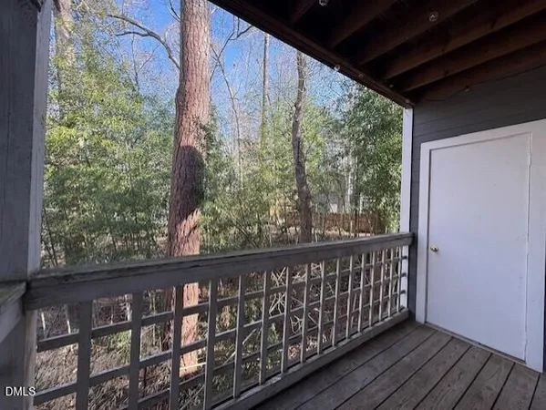 a view of balcony with wooden floor