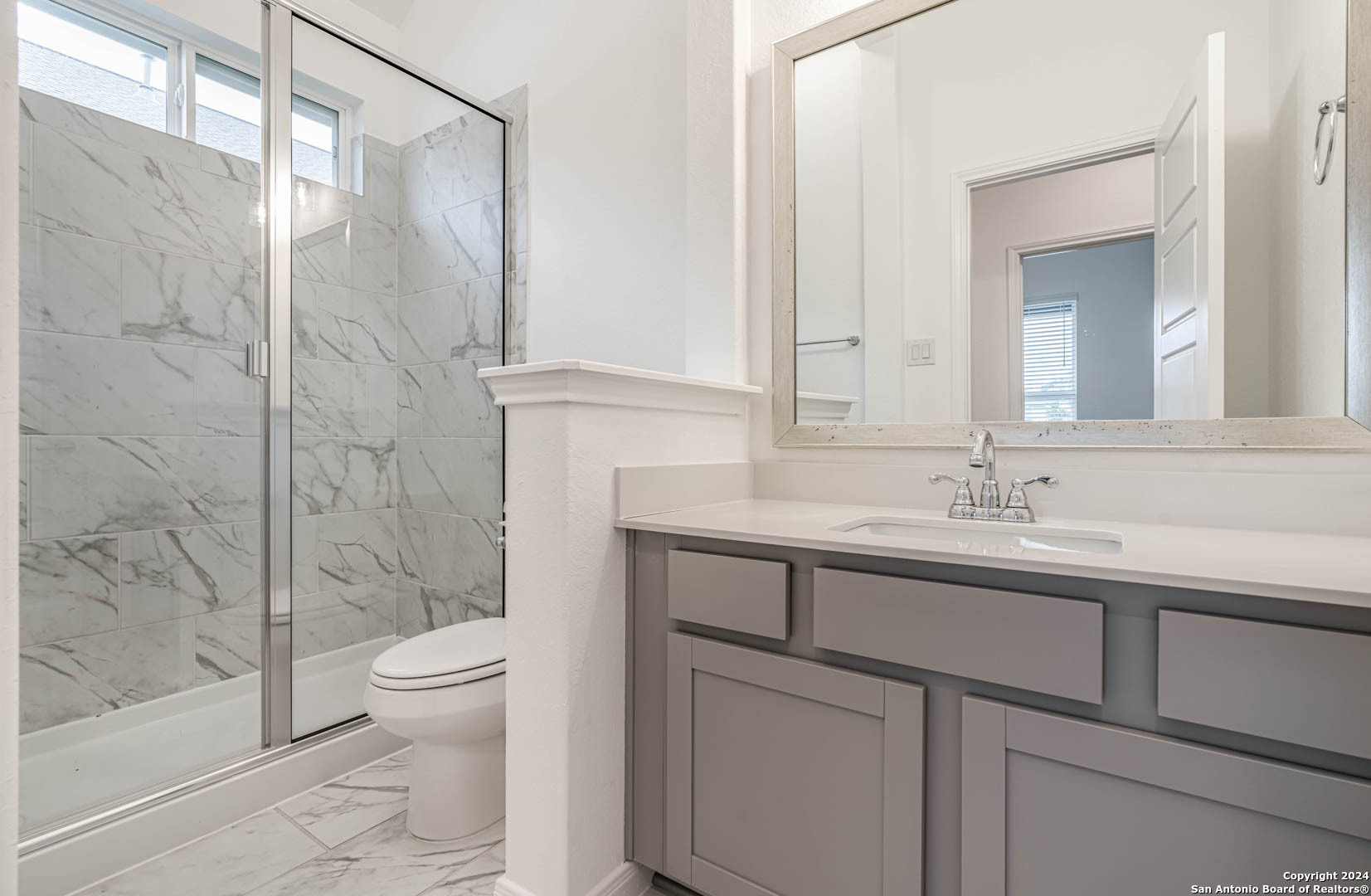 113 Valencia Boerne, TX 78006 - Photo 12 of 43 a bathroom with a sink toilet and shower