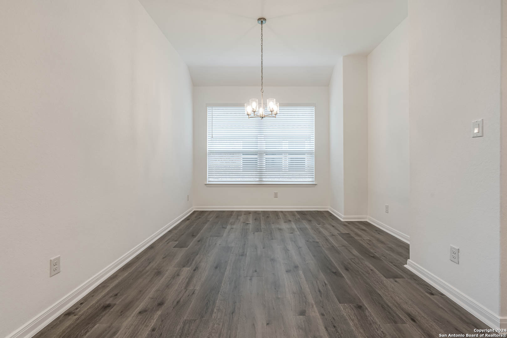 113 Valencia Boerne, TX 78006 - Photo 15 of 43 an empty room with wooden floor and windows