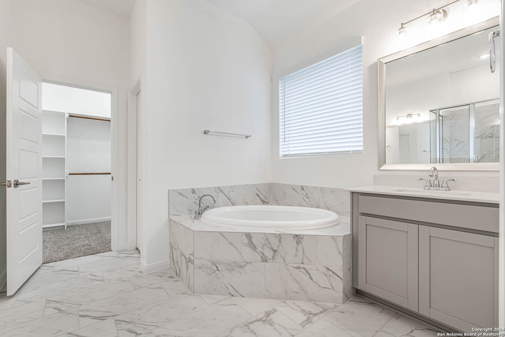 113 Valencia Boerne, TX 78006 - Photo 26 of 43 a bathroom with a sink and a mirror
