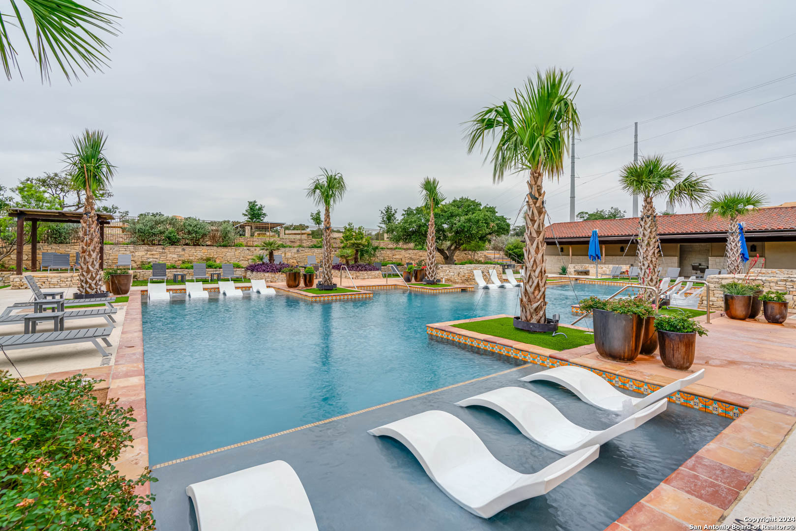 113 Valencia Boerne, TX 78006 - Photo 38 of 43 a view of a swimming pool with outdoor seating and plants