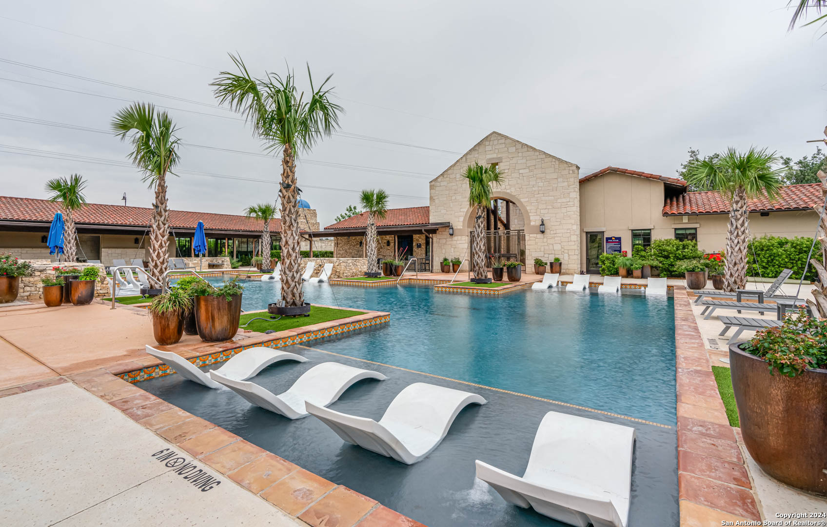 113 Valencia Boerne, TX 78006 - Photo 39 of 43 a view of a swimming pool with chairs
