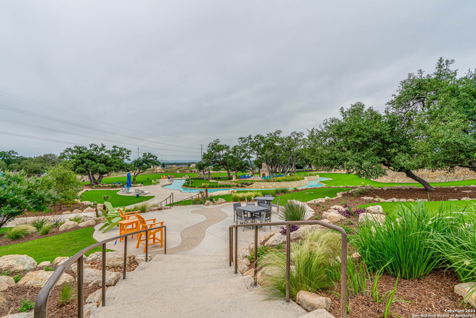 113 Valencia Boerne, TX 78006 - Photo 40 of 43 an aerial view of a swimming pool with a yard and outdoor seating