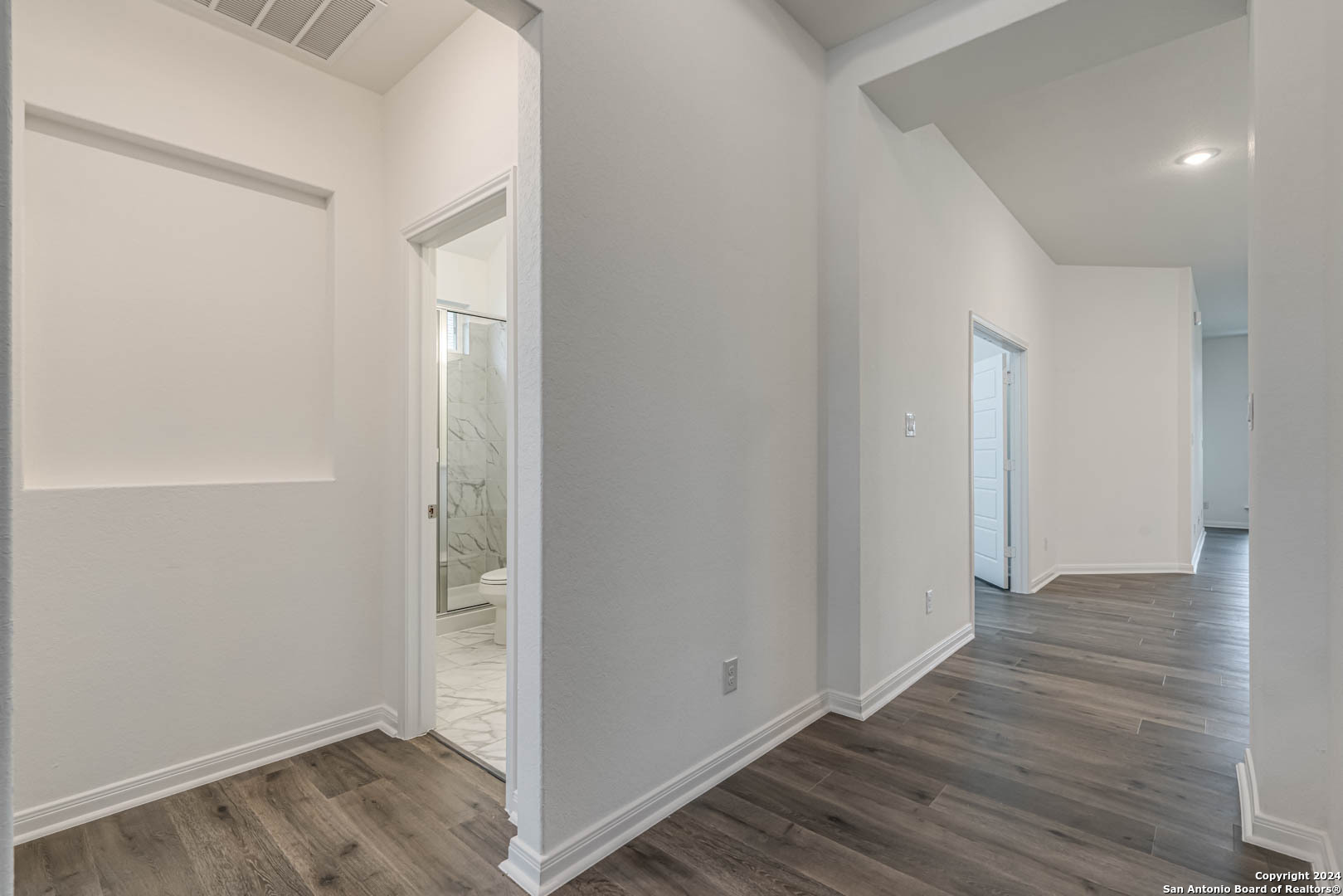 113 Valencia Boerne, TX 78006 - Photo 9 of 43 an empty room with wooden floor & windows