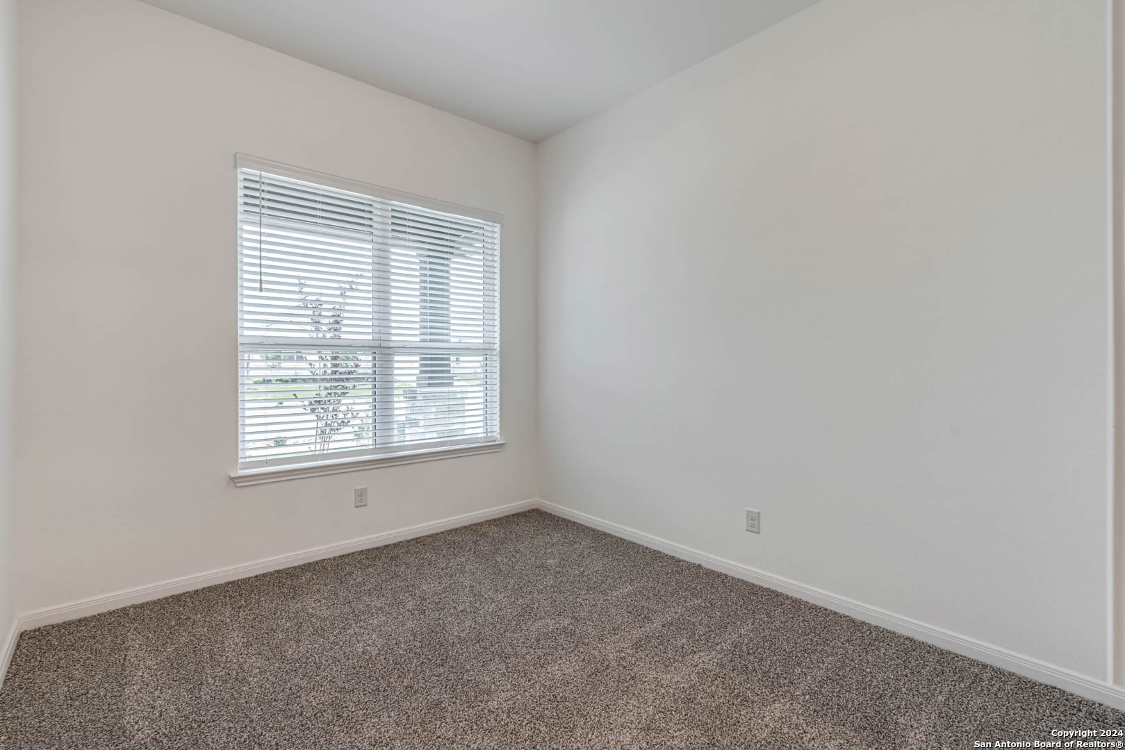 113 Valencia Boerne, TX 78006 - Photo 10 of 43 an empty room with a window