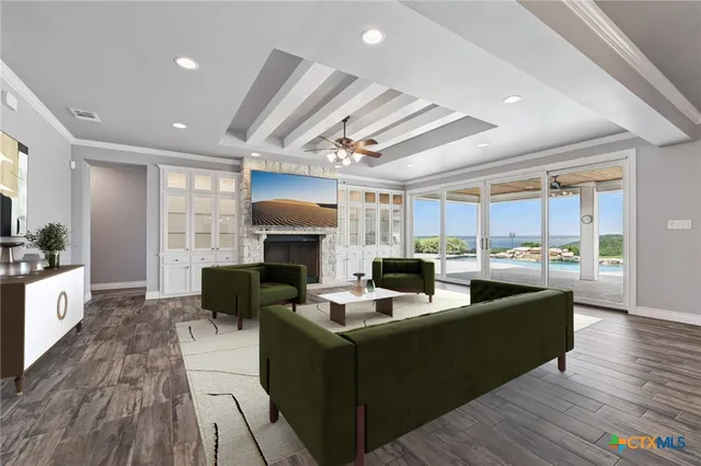 a living room with fireplace furniture and a wooden floor