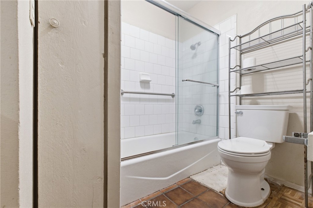 456 West Bennett Street Compton, CA 90220 - Photo 6 of 13 a bathroom with a toilet and a shower
