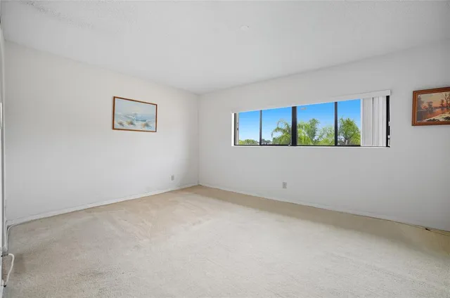 a view of a livingroom with furniture and cabinet