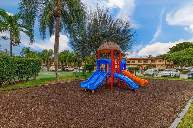 a view of a house with backyard patio and lake view
