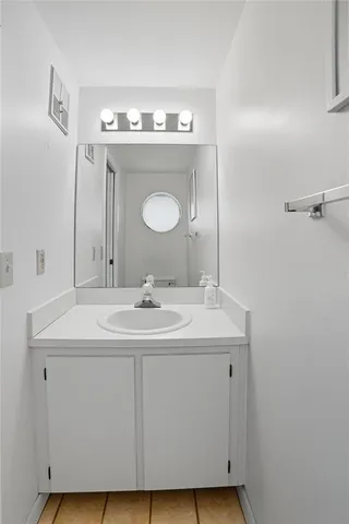 a bathroom with a sink and a mirror