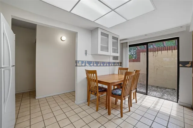 a view of a dining room with furniture and window