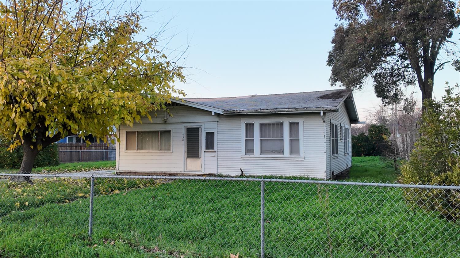 430 Laurel Avenue Modesto, CA 95351 - Photo 2 of 6 a front view of house with yard and green space