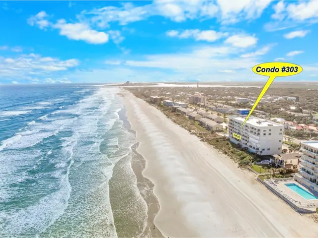 a view of a room with furniture and a window