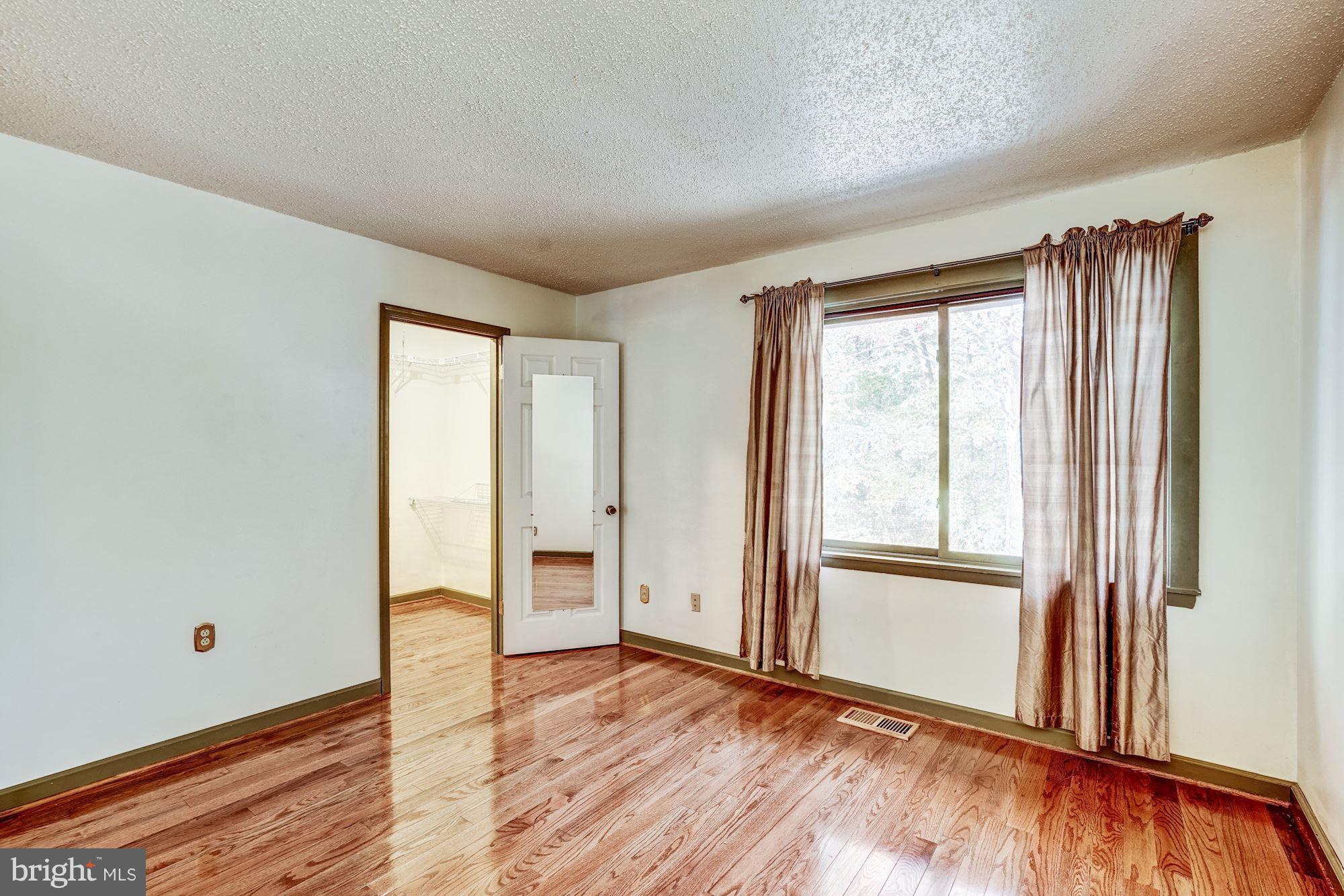 2254 Coppersmith Square Reston, VA 20191 - Photo 11 of 25 Master Bedroom with Walk-In Closet