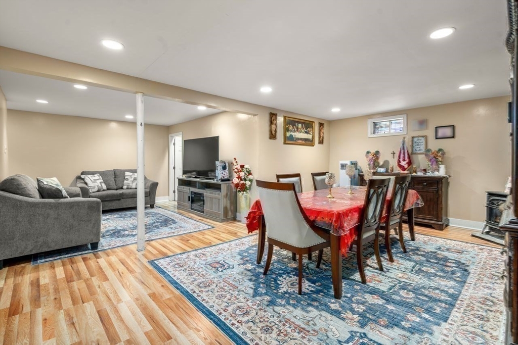 231 Lapham Street Fall River, MA 02721 - Photo 17 of 20 a living room with dining room and wooden floor