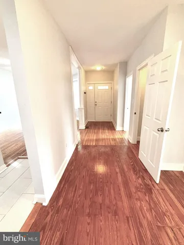 a view of a room with wooden floor and stairs