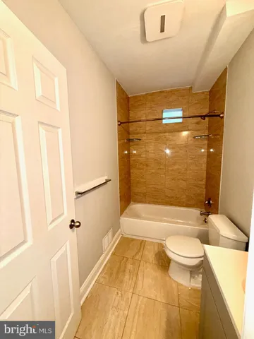 a bathroom with a bathtub and shower