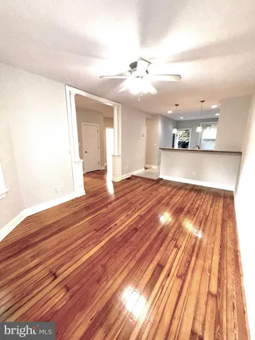 a view of a room with wooden floor